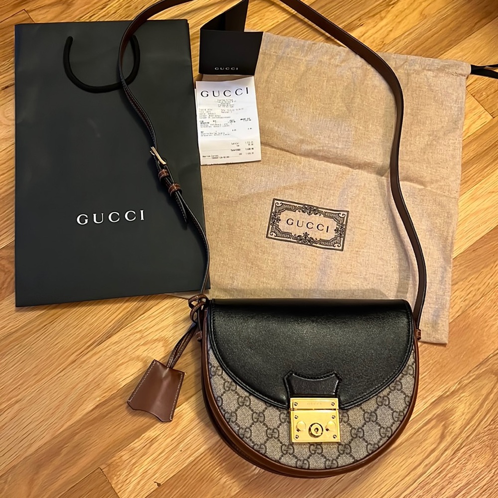 Gucci cross body bag. 9 x 8 x 2 1/2 adjustable strap 46 inches full length.